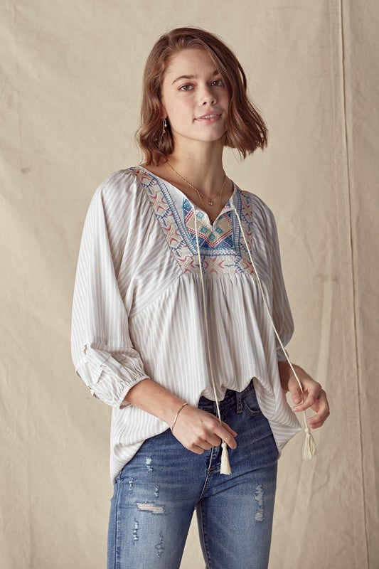 Embroidered Patch Trim Top With A Tassle